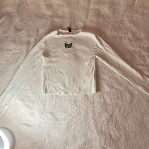 White long sleeve crop top with butterfly